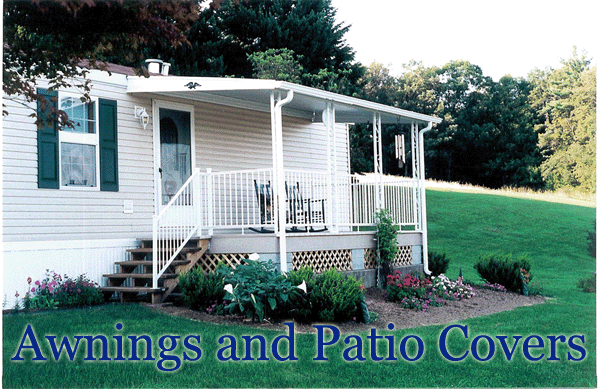 White mobile home with a white porch and awning