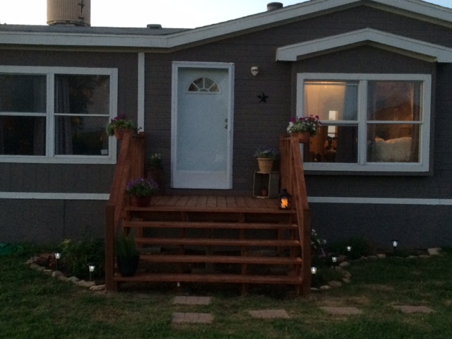 Front Of Mobile Home With Updated Porch, New Skirting And New Gutter Trim.