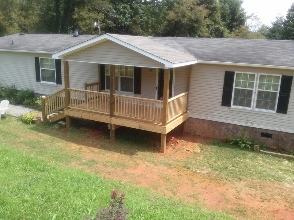 Outside Of The Mobile Home With A Newly Built Front Porch.