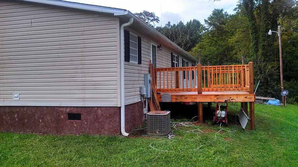 Back Of the Mobile Home With A New Back Deck Built.