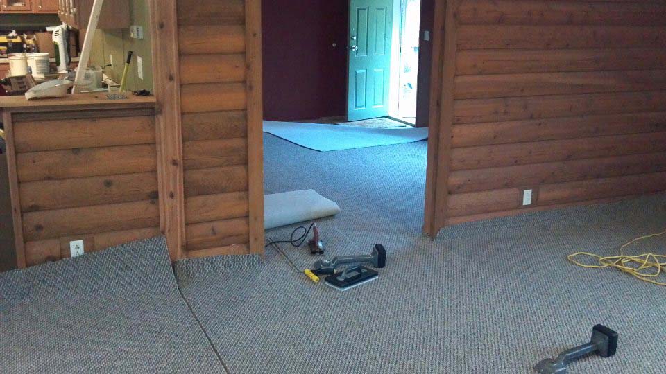 Putting Down New Carpet In The Mobile Home.