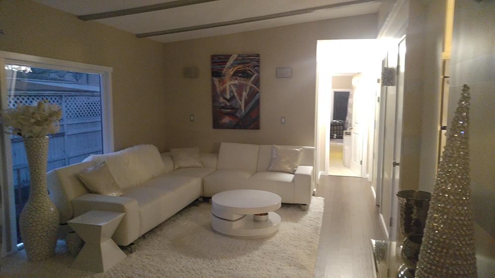Living Room With Modern White Furniture And Beige Walls.