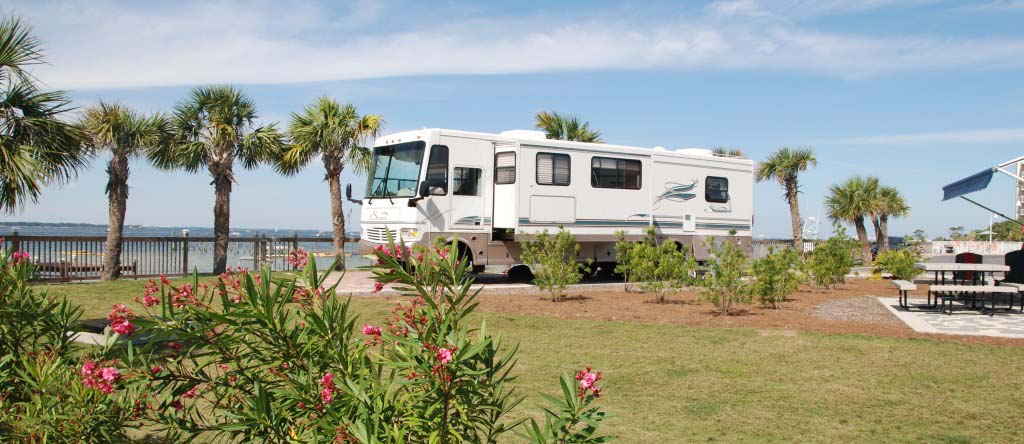 RV Parked In Front Of The Ocean.