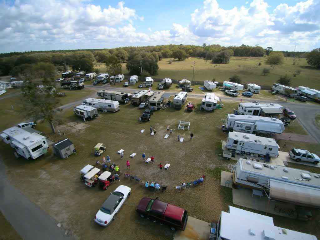 Overhead View Of People Playing Cornhole Between RVs.