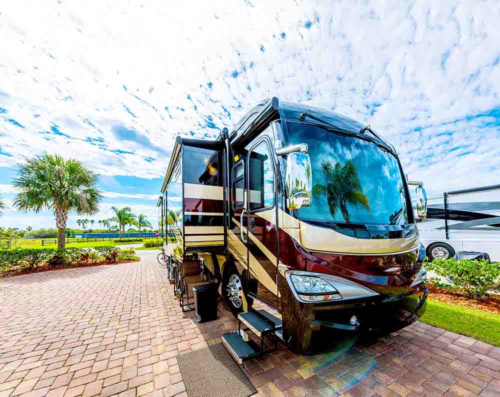 RV Parked Between Palm trees.
