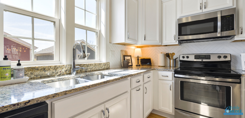 mobile home kitchen with a microwave exhaust fan
